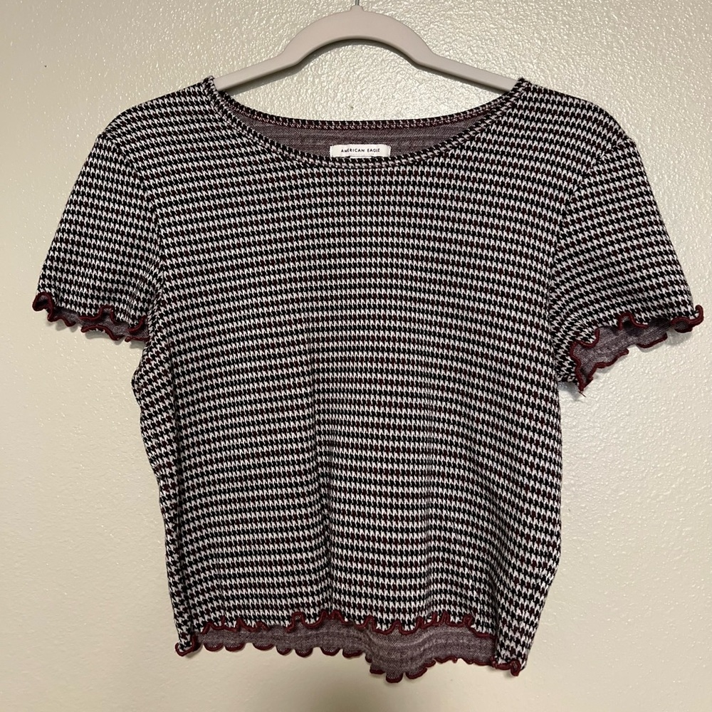 American eagle black and white crop top with maroon detail.